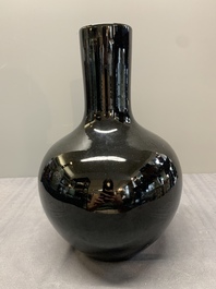 A Chinese black-glazed 'tianqiu ping' vase and a flamb&eacute;-glazed bottle vase, 19/20th C.