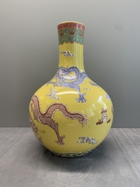 A Chinese famille rose yellow-ground 'dragon' 'tianqiu ping' vase, 20th C.