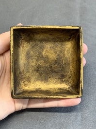 A Chinese square gilt bronze ink box and cover (印泥盒), Xuande mark and possibly of the period