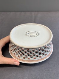 A Chinese openworked famille rose 'antiquities' basket and stand, Qianlong