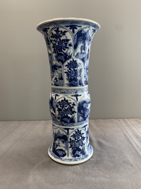 Two Chinese blue and white 'gu' vases with landscape and floral panels, Kangxi