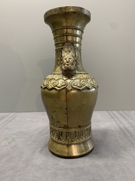 A Chinese bronze vase with lion-form handles, 17/18th C.