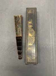 Two Chinese Canton gilt-lacquered and painted paper fans, one with original box, 19th C.