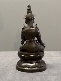 A Vietnamese bronze deity on a lotus throne, 18/19th C.