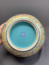 A Chinese famille rose turquoise-and-yellow-ground 'dragon' bowl on wooden stand, Qianlong mark, Republic