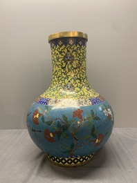 A pair of large Chinese cloisonn&eacute; 'magpies among flowering branches' vases, 19th C.