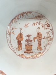 A Chinese iron-red and gilt-decorated 'ladies in a garden' bowl, Kangxi