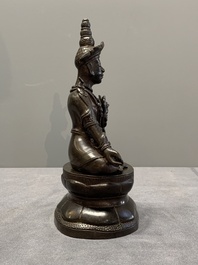 A Vietnamese bronze deity on a lotus throne, 18/19th C.