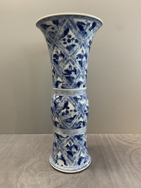 A Chinese blue and white 'landscape' 'gu' vase, Kangxi
