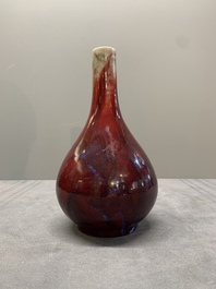 A Chinese black-glazed 'tianqiu ping' vase and a flamb&eacute;-glazed bottle vase, 19/20th C.