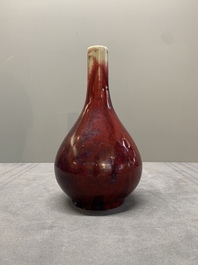 A Chinese black-glazed 'tianqiu ping' vase and a flamb&eacute;-glazed bottle vase, 19/20th C.