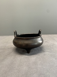 A Chinese bronze tripod censer, Xuande mark, 17/18th C.
