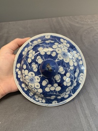 Two Chinese blue and white 'prunus on cracked ice' vases and covers, Kangxi mark, 19th C.