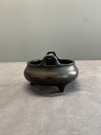 A Chinese bronze tripod censer, Xuande mark, 17/18th C.