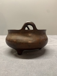 A Chinese bronze tripod censer, Xuande mark, Ming