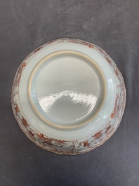 A Chinese iron-red and gilt-decorated 'ladies in a garden' bowl, Kangxi