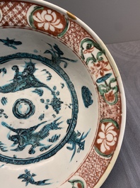 Two Chinese Swatow red-, turquoise- and black-enamelled 'phoenixes' and 'river landscape' dishes, Ming