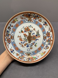 A Chinese famille rose 'antiquities' dish and two plates, Yongzheng/Qianlong