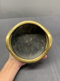 A Chinese bronze tripod censer on a wooden stand, Song Zhu Xuan 松竹軒 mark, 18th C.
