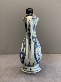 A Chinese silver-mounted blue and white ewer with figures in a landscape, Ming