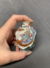 A Chinese famille rose molded 'capsized boat' snuff bottle, Qianlong mark, 19th C.