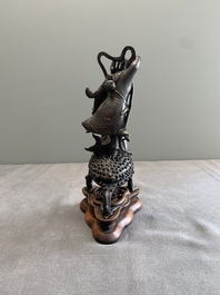 A rare Chinese bronze incense burner and cover in the shape of Liu Hai and a three legged toad, Ming