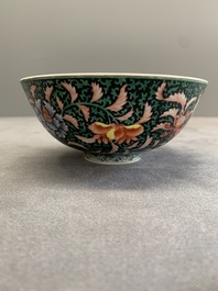 A Chinese black-ground famille rose 'flower scroll' bowl, Qianlong mark and of the period