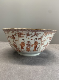A Chinese iron-red and gilt-decorated 'ladies in a garden' bowl, Kangxi