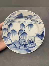 A pair of Chinese blue and white plates with a breastfeeding woman and fishermen on boats, Chenghua mark, Kangxi
