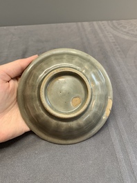 A Chinese Longquan celadon 'twin fish' dish and two 'twin fish' saucers, Yuan/Ming