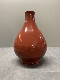 A Chinese copper-red-glazed pear-shaped vase, Yongzheng mark and of the period