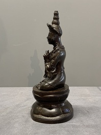A Vietnamese bronze deity on a lotus throne, 18/19th C.