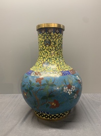 A pair of large Chinese cloisonn&eacute; 'magpies among flowering branches' vases, 19th C.