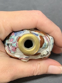 A Chinese famille rose molded 'capsized boat' snuff bottle, Qianlong mark, 19th C.