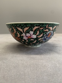 A Chinese black-ground famille rose 'flower scroll' bowl, Qianlong mark and of the period