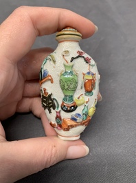 A Chinese molded famille rose 'antiquities' snuff bottle and porcelain stopper, Qianlong mark, 19th C.