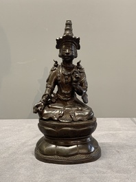 A Vietnamese bronze deity on a lotus throne, 18/19th C.