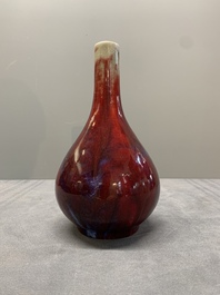 A Chinese black-glazed 'tianqiu ping' vase and a flamb&eacute;-glazed bottle vase, 19/20th C.