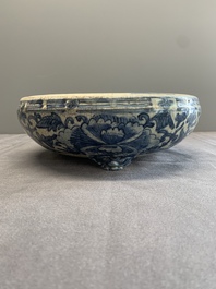A Chinese Swatow blue and white crackle-glazed 'peonies and trigrams' tripod censer, Ming
