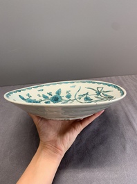 A Chinese Swatow turquoise- and black-enamelled 'carp, narcissus and chrysanthemum' plate and a tomobako, Ming