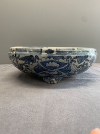 A Chinese Swatow blue and white crackle-glazed 'peonies and trigrams' tripod censer, Ming