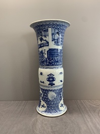 A Chinese blue and white 'gu' vase with a lady and antiquities, Kangxi