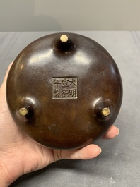 A Chinese bronze tripod censer, Xuande mark, Ming