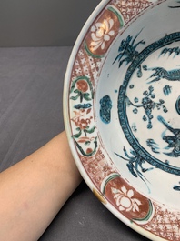 Two Chinese Swatow red-, turquoise- and black-enamelled 'phoenixes' and 'river landscape' dishes, Ming