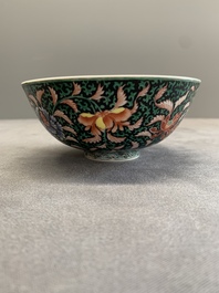 A Chinese black-ground famille rose 'flower scroll' bowl, Qianlong mark and of the period