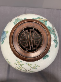 A Chinese famille rose '100 boys' jar and wooden cover, 19th C.