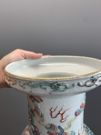 A pair of Chinese famille rose '18 luohan' vases with relief design, 19th C.