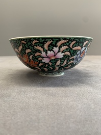 A Chinese black-ground famille rose 'flower scroll' bowl, Qianlong mark and of the period