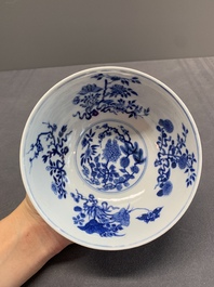 A Chinese blue, white and famille rose bowl with floral design, Qianlong mark, 19/20th C.