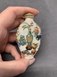 A Chinese molded famille rose 'antiquities' snuff bottle and porcelain stopper, Qianlong mark, 19th C.